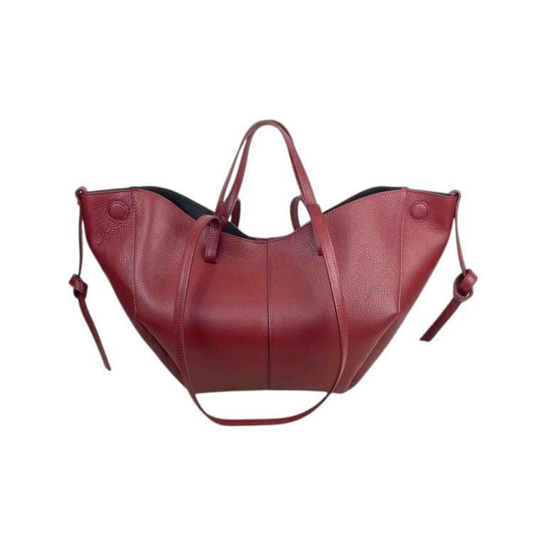 Elegant Italian leather handbag in rich burgundy, featuring convertible size and magnetic closure for versatile styling.