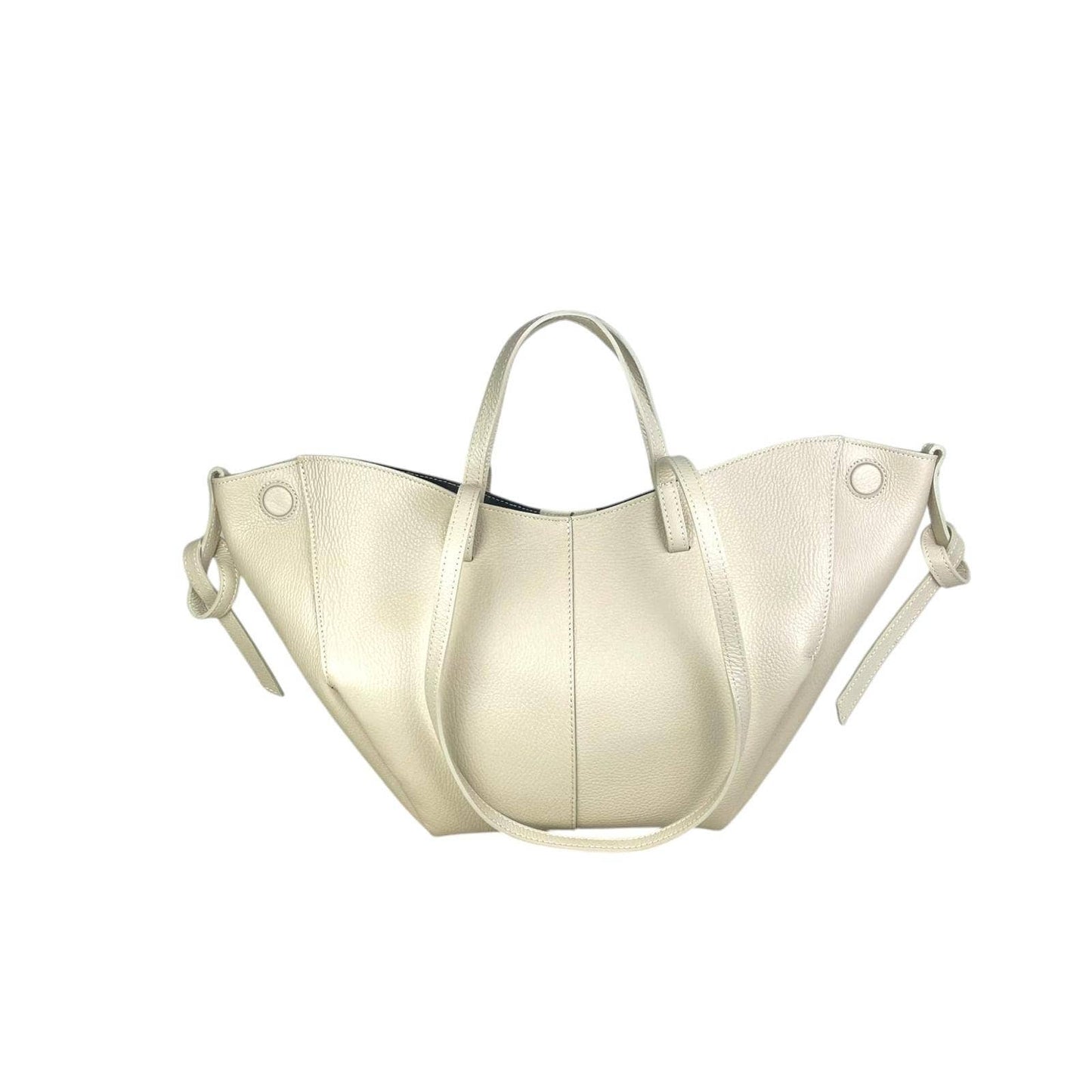 Elegant Italian leather handbag in soft beige with convertible design and magnetic closure.