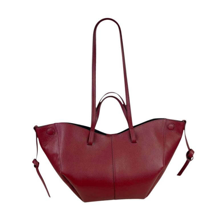 Elegant Italian leather handbag in deep red with convertible size and magnetic closure for modern women.