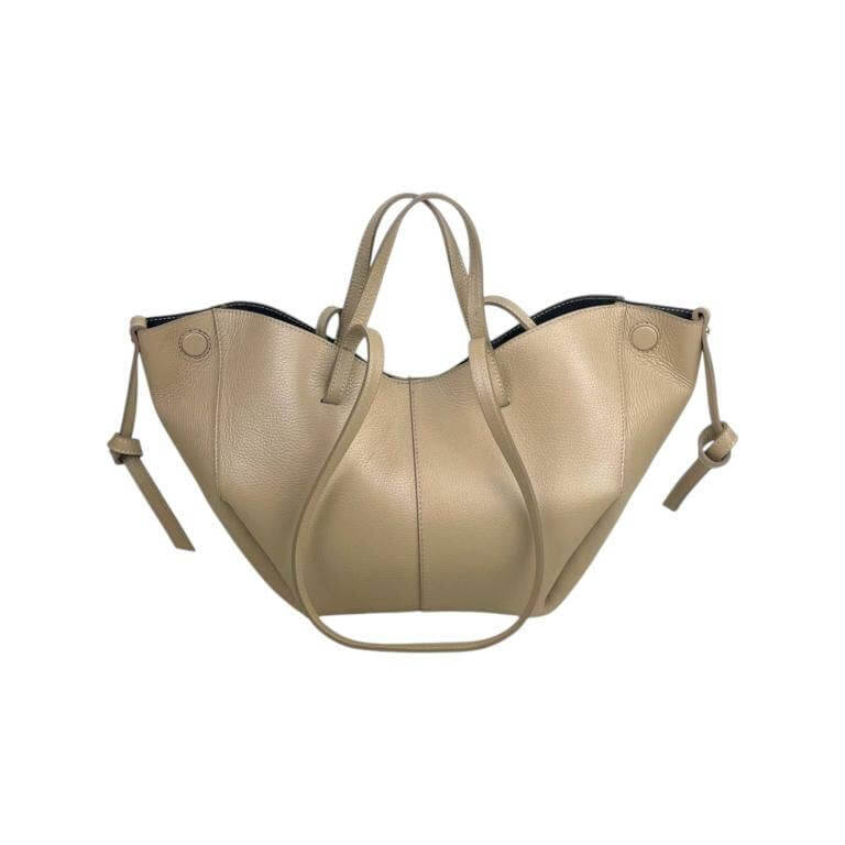 Elegant Italian leather handbag with convertible size, featuring magnetic closure and stylish beige design.