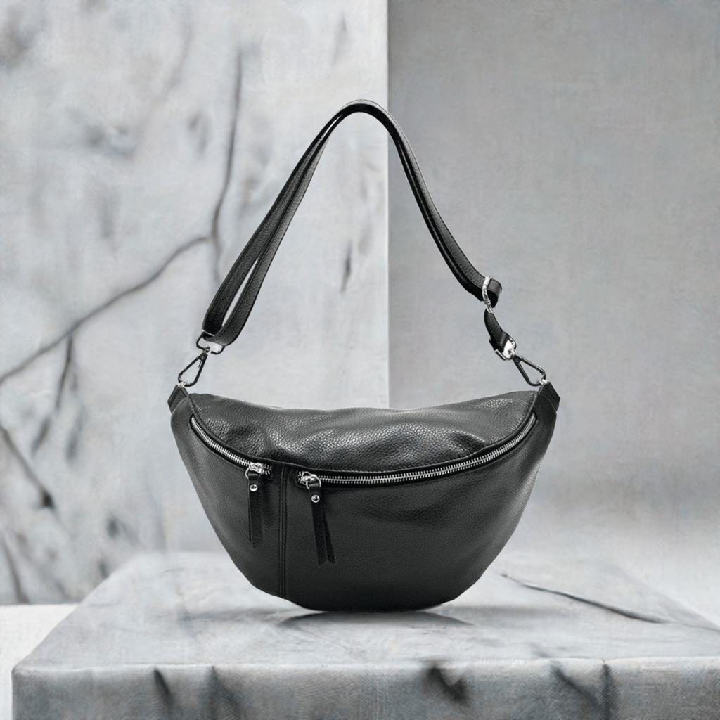 Stylish black Nova Crossbody Fanny Pack crafted from Italian leather, showcasing a modern design and functional features.